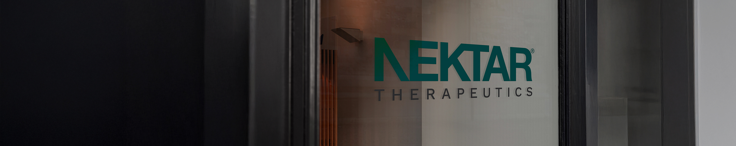 Teal Nektar Therapeutics Logo on Glass