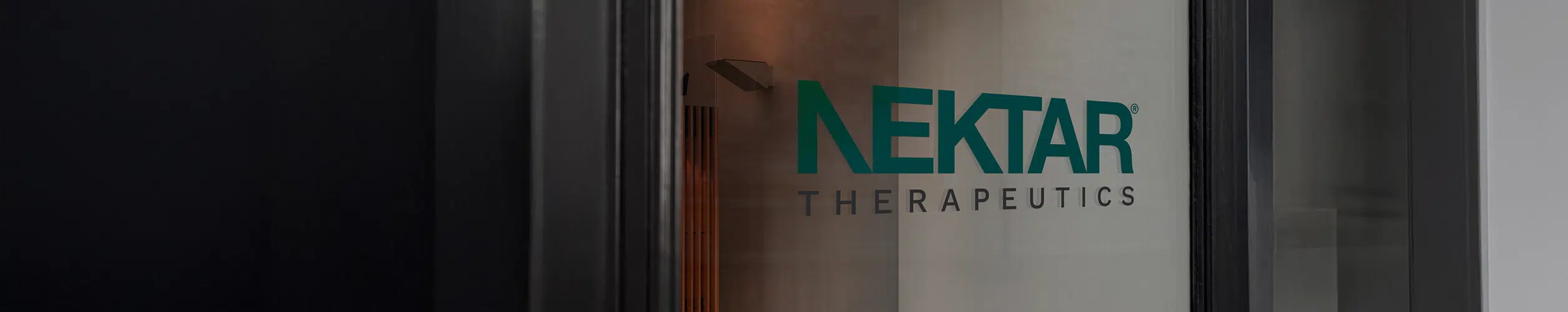 Teal Nektar Therapeutics Logo on Glass